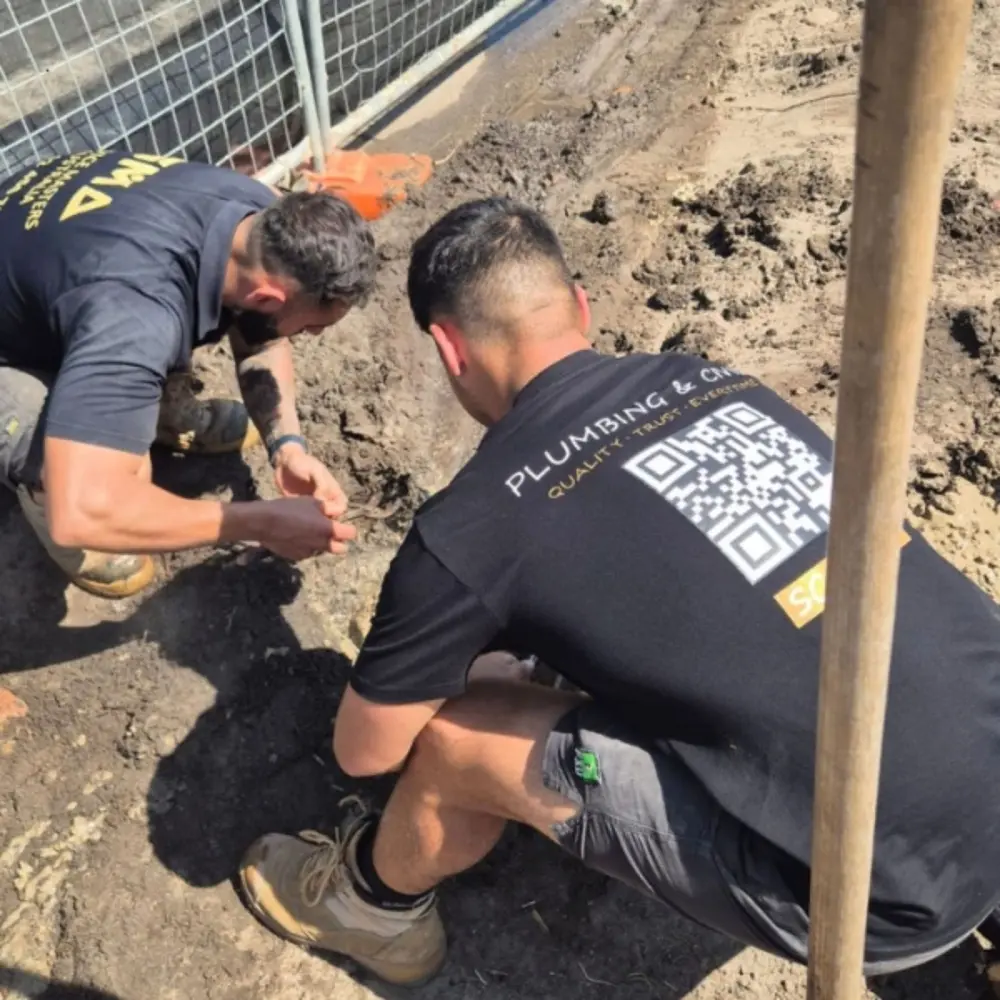 SMA plumbers working on pipework on site