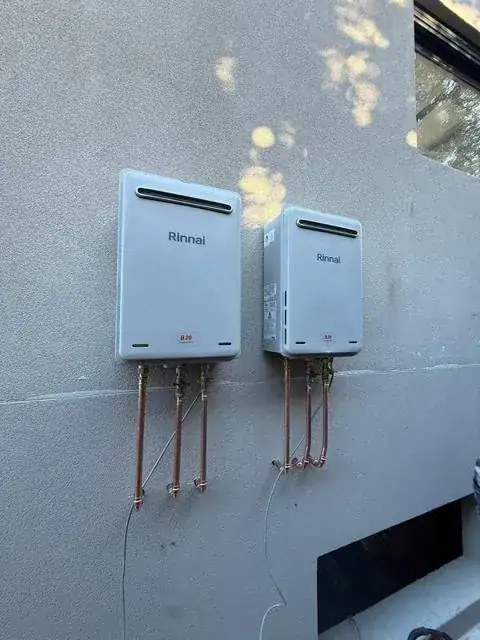Twin Rinnai continuous flow hot water units installed with new copper pipework